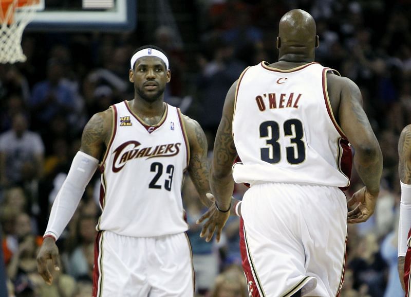 <a href='https://www.sportskeeda.com/basketball/lebron-james' target='_blank' rel='noopener noreferrer'>LeBron</a> James #23 of the Cleveland Cavaliers congratulates Shaquille O'Neal #33 after his basket against the Boston Celtics